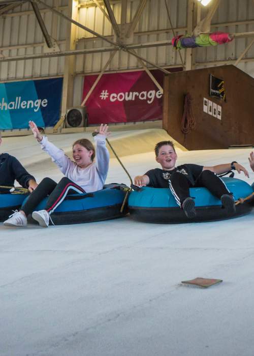 Family in ringos at indoor slope at Calshot Activities Centre in the New Forest - Activities