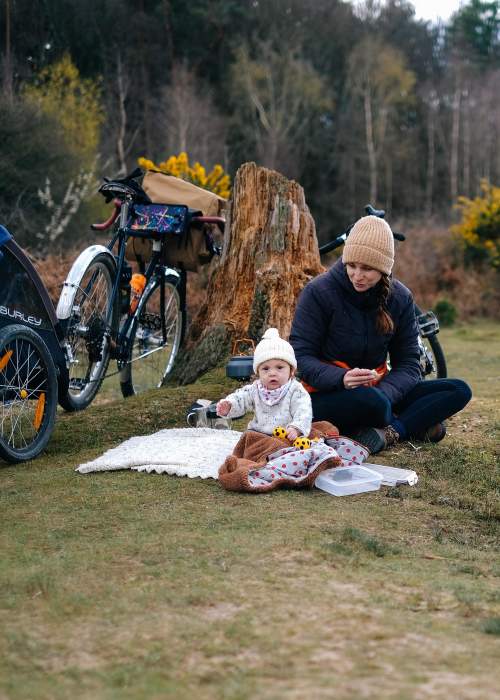 Mum and Baby having a rest from cycling in the winter in the New Forest - Cycling
